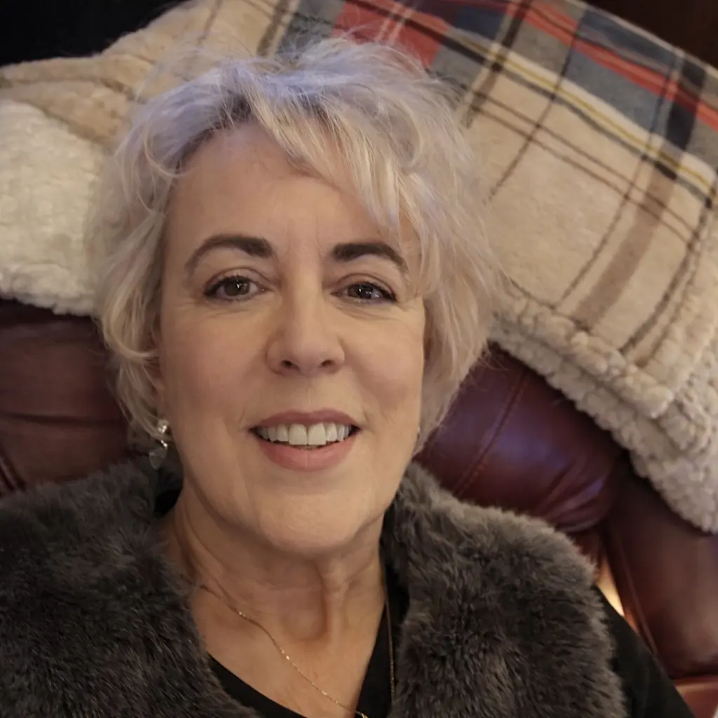 Smiling woman with short blonde hair